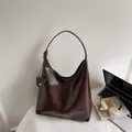 Dark brown high-gloss hobo shoulder bag with a matching mini pouch and knot detail - Coffee