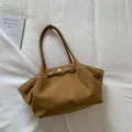Brown suede tote bag with minimalist shoulder strap and side metal buckle design - Brown