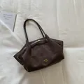 Large dark brown suede tote bag for women with gold logo and adjustable shoulder strap - Brown