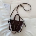 Top view of retro brown suede tote bag with leopard print handle and beaded details - Brown