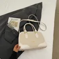Elegant cream beige crossbody handbag with suede contrast and gold stud details - Off White