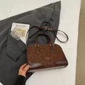 Stylish brown leopard print handbag with leather texture and shoulder strap - Brown