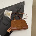 Chic dark brown leather and leopard print crossbody bag with gold fashion lettering - Brown