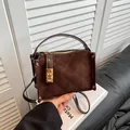 Dark brown square crossbody bag with quilted suede texture and metal rivet accents - Brown