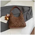 Women's leopard print hobo bag with brown leather strap and plush bear charm - Leopard Print With Pendant