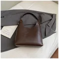 Minimalist deep brown leather hobo shoulder bag with metal ring strap connectors - Coffee without Pendant