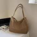 Minimalist large khaki tote bag made of soft nylon fabric for women's daily commute - Khaki