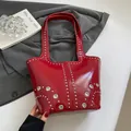 Vintage red patent leather shoulder bag with silver studs and rock style buckles - Red