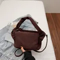 Minimalist dark brown suede nylon shoulder bag with elegant pleated texture and strap - Brown