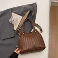 Dark brown woven bucket handbag with an adjustable jacquard shoulder strap - Dark Brown
