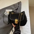 Elegant black pleated cloud bag with gold chain strap and suede texture finish - Black