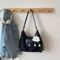 Black crinkle texture backpack with silver star detail and cloud plush charm - Black