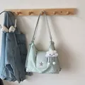 Mint green women's casual shoulder bag with star charm and soft pleated fabric design - Green