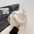 Chic cream white plush bucket bag with soft faux fur texture and leather strap - White