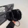 Chic black faux fur bucket bag with plush handle and silver hardware detail - Black