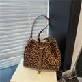 Chic leopard print bucket bag with drawstring closure and golden chain detail - Leopard Print No Charm