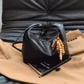 Large black leather hobo bag with vintage texture and colorful wooden bead charms - Black with Pendant