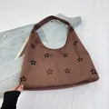 Dark brown suede tote bag with laser-cut floral patterns and a vintage hobo silhouette - Brown