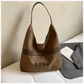Vintage dunkelbraune Canvas Tragetasche mit schwarzem Gurt und minimalistischem Grafikdesign - Braun