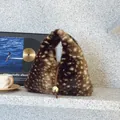 Brown deer print faux fur triangle handbag with a golden metal bead and handle detail - Brown