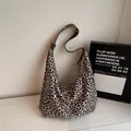 Large capacity leopard print hobo bag featuring brown leather shoulder strap and gold buckle - Off-white