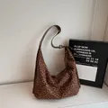 Vintage leopard print hobo bag with brown leather shoulder strap in spacious crescent shape - Brown