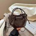 Minimalist dark brown bucket bag with drawstring closure and vintage gold hardware - PU Coffee