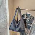 Large capacity tote bag in blue denim fabric with wide shoulder strap and casual style - Blue