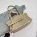 Retro beige faux leather underarm bag with adjustable buckle strap and silver grommets - Khaki