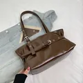 Dark brown retro underarm bag in glossy leather with silver eyelet belt detail - Brown