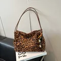 Large leopard print faux suede tote bag with brown straps and beaded tassel charm - Leopard Print With Pendant