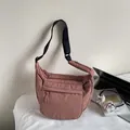 Dark pink casual crossbody bag with quilted texture and adjustable wide black strap - Dusty Pink