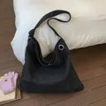 Detail of black large tote bag with animal texture and silver metal ring buckle - Black