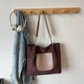 Dark brown suede tote bag with beige pocket and chain strap in casual setting - Coffee