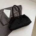 Minimalist black matte tote bag in soft suede finish with sleek structural stitching - Black