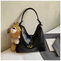 Black matte leather tote bag with gold ring buckle and a cute lion plush keychain - Black with Pendant