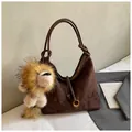 Minimalist deep brown suede tote bag with hobo curve and plush lion charm decoration - Coffee with Pendant