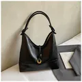 Fashionable black matte leather tote bag with elegant golden ring and knotted handles - Black without Pendant