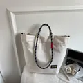 Off-white large capacity tote bag with woven rope handles and minimalist urban style - Off-white