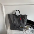Minimalist large-capacity dark gray tote bag with mesh texture and rope handles - Gray