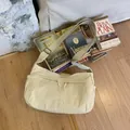 Minimalist beige nylon crossbody bag with adjustable strap and metal hardware - Beige
