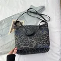 Deep blue leopard print bucket bag with adjustable strap and silver-tone hardware - Black