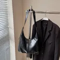 Classic black hobo bag in premium glossy leather with shoulder strap and zip closure - Black without Pendant