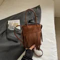 Retro dark brown suede bucket bag with long fringe and adjustable strap for women - Brown