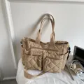 Khaki quilted nylon tote bag with multiple pockets for daily commuting and travel - Khaki