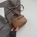 Elegant brown faux leather crossbody bag with top handle and fashion letter embossing - Brown No Pendant