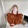 Caramel orange quilted tote bag with large zipper pockets for autumn commuting fashion - Orange