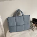 Quilted puffer tote bag in grey-blue with padded square texture and soft top handles - Blue