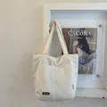 Quilted beige cotton-padded tote bag with side pocket and premium leather logo detail - No Pendant / White