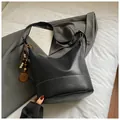 Black large capacity hobo bucket bag with white contrast stitching and wood bead charm - With Pendant / Black